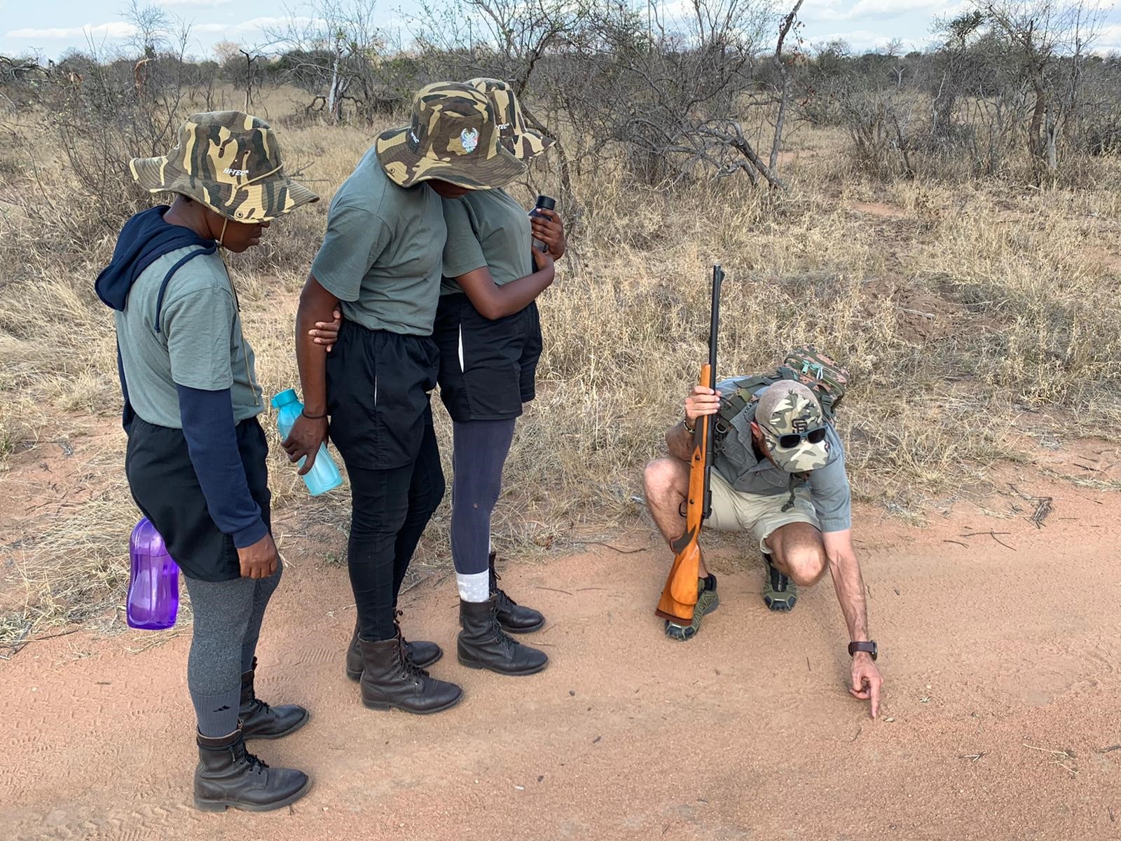 Black mambas crime prevention unit standing on path